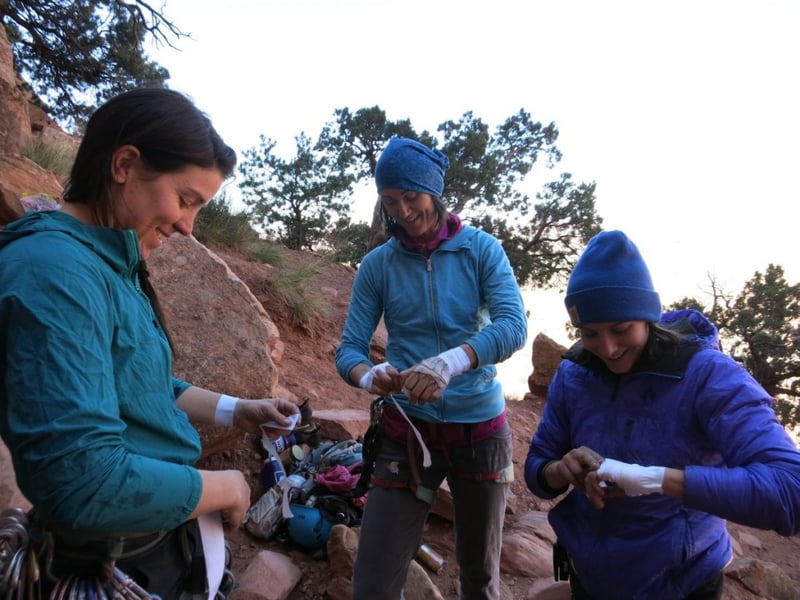 group of women taping up to climb in Cochise Stronghold
