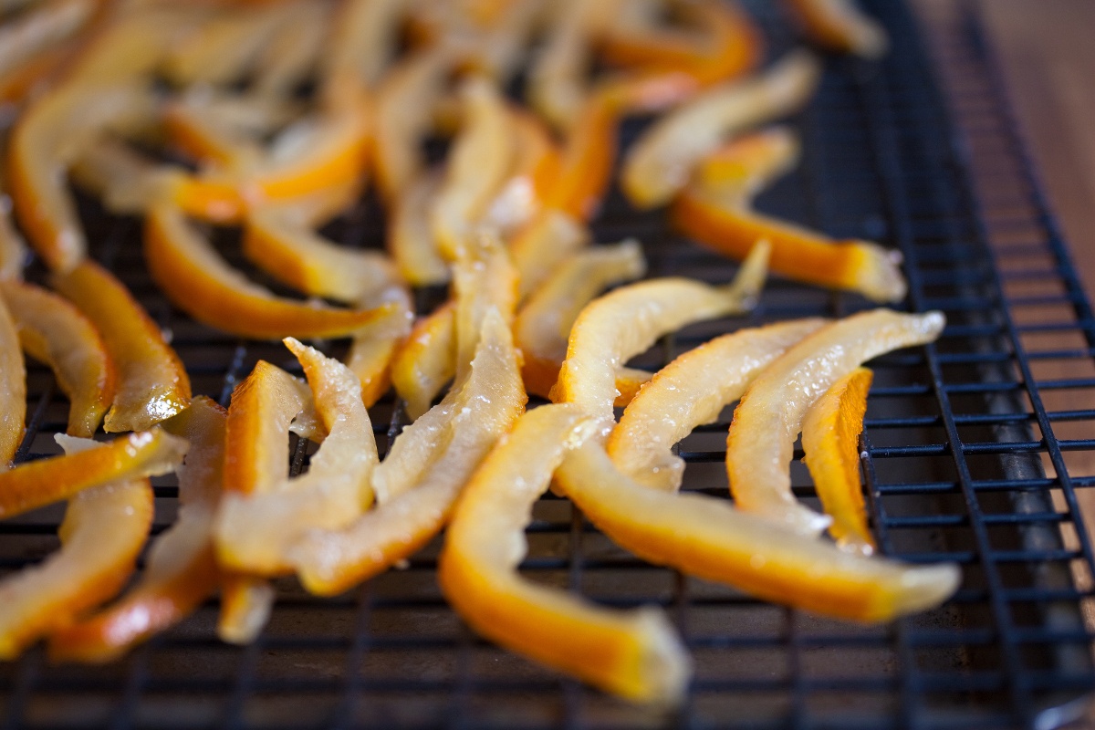 Thinly sliced orange peels on a grate
