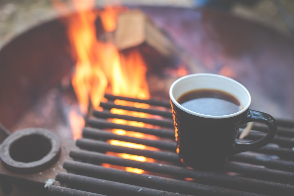 Hot coffee on a grate over a fire