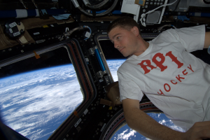 Reid enjoys the view from the Cupola on the International Space Station.