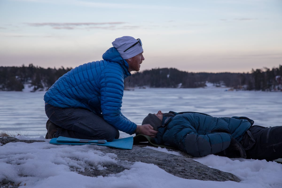 Rescuer and patient in the snow