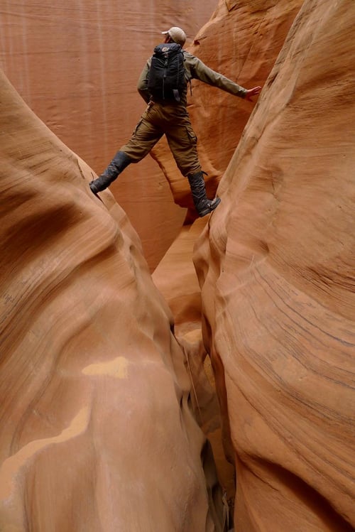 Person hiking in slot canyon