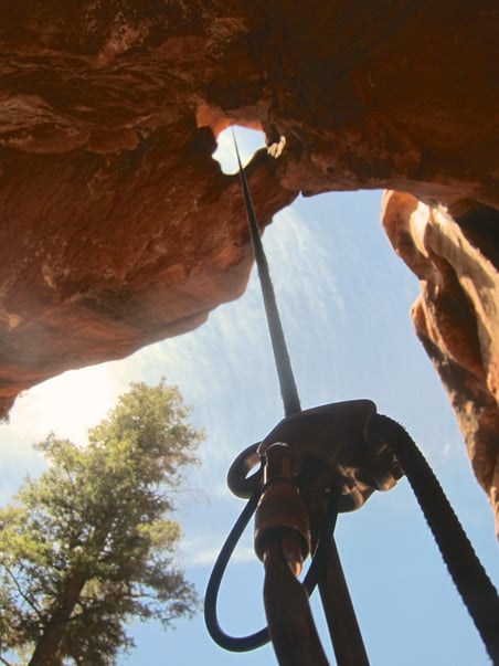 View looking up from a rappel in a canyon