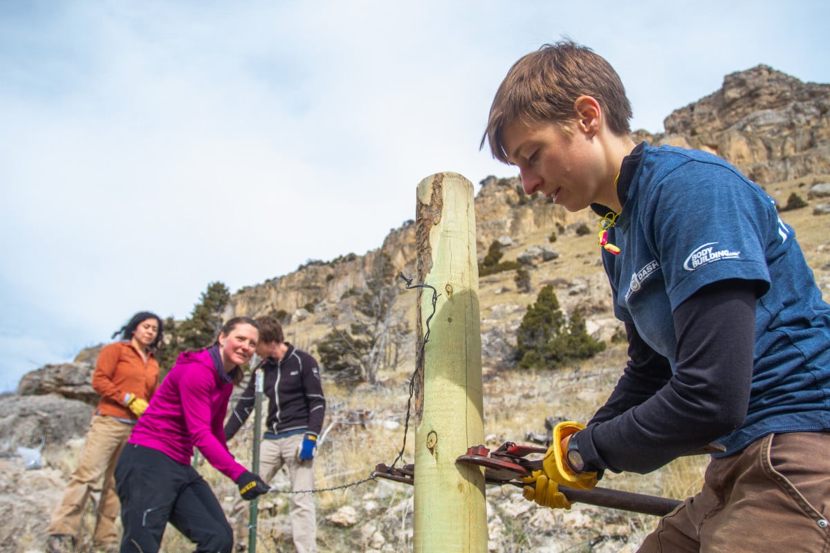 Group working on a trail crew mending fence