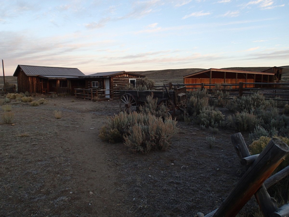 log and wooden buildings at NOLS Three Peaks Ranch in Boulder, Wyoming