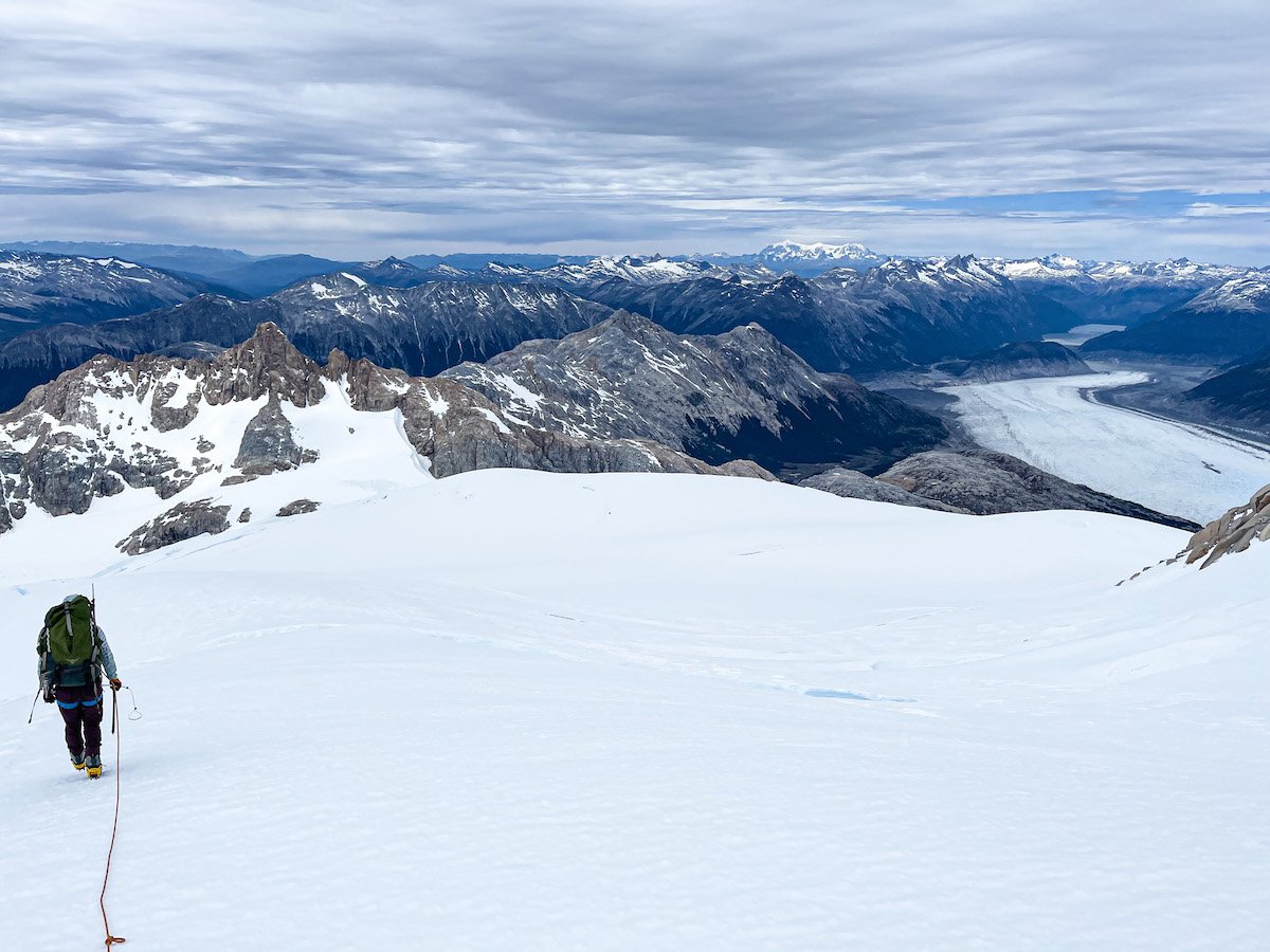 Mountaineer leads down a glacier