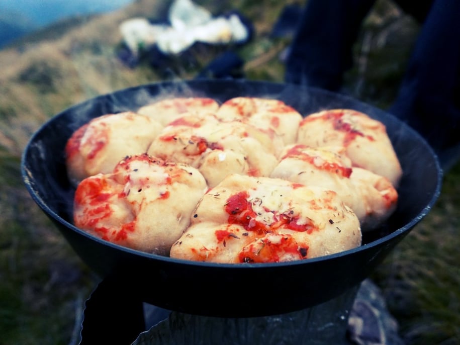 Steaming pan of hot mini calzones