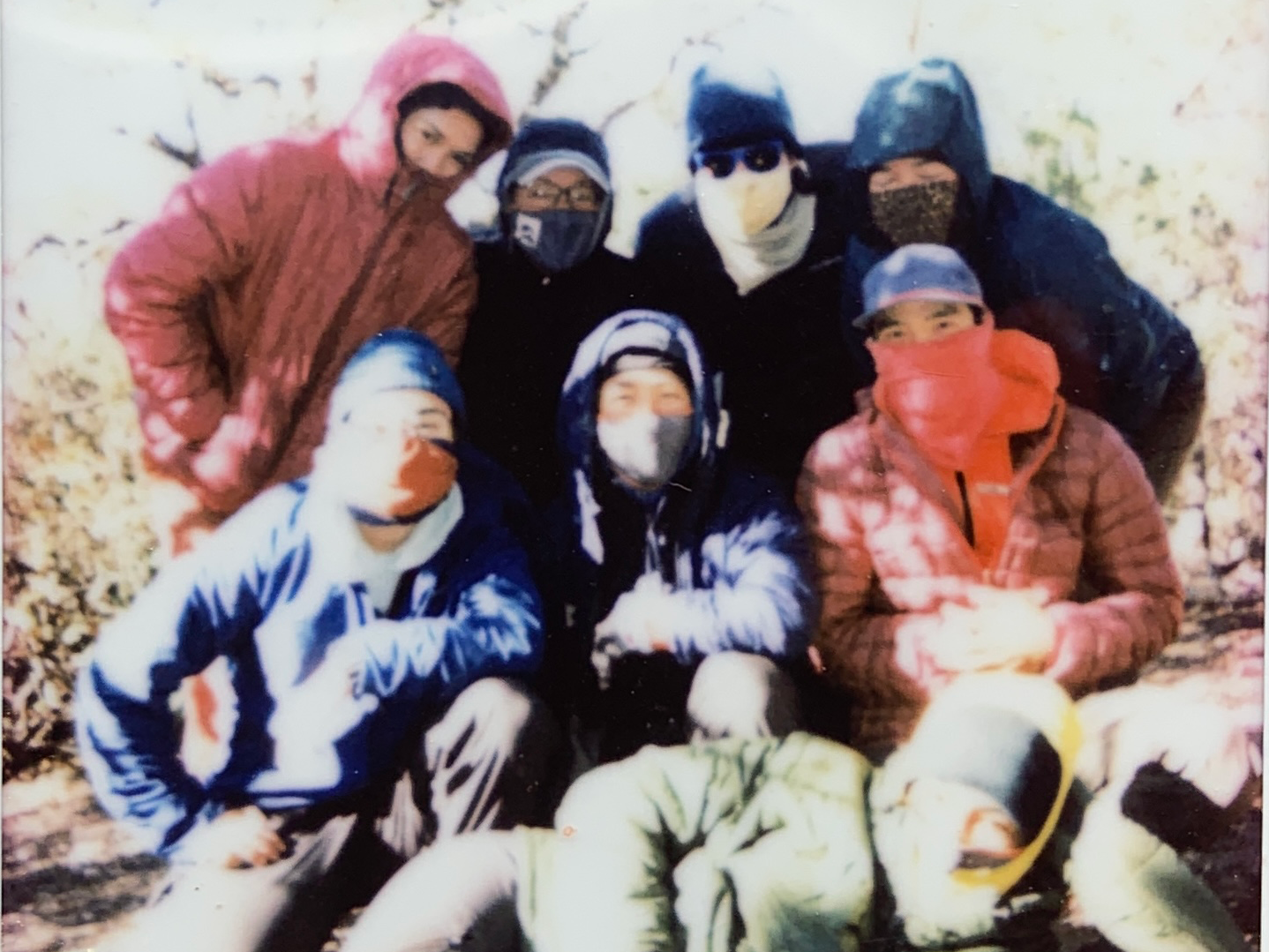 A group of students gathered in the wilderness for a group photo.