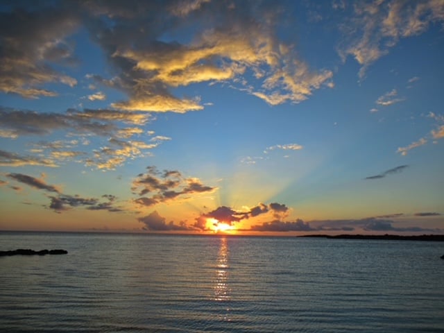 Sunset in the clouds over the ocean