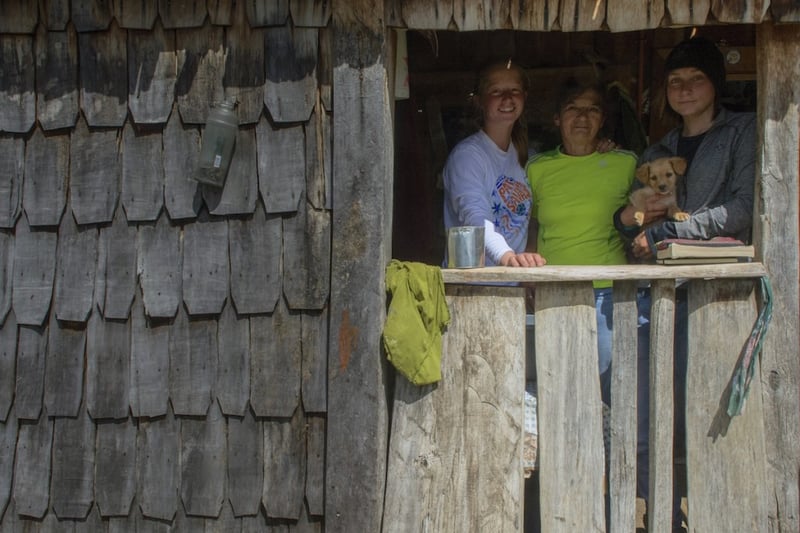 two NOLS students with host family in Patagonia