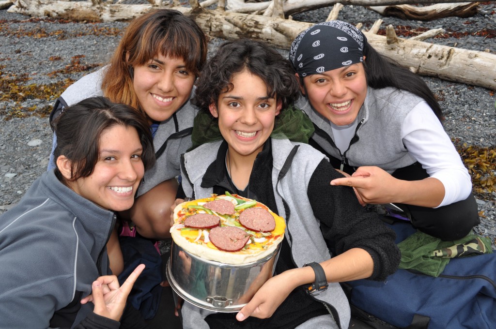 For teens point to a pizza resting on a pot