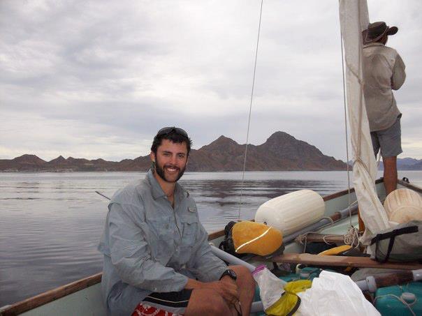 NOLS student sits in a sailboat on a semester in Baja California, Mexico