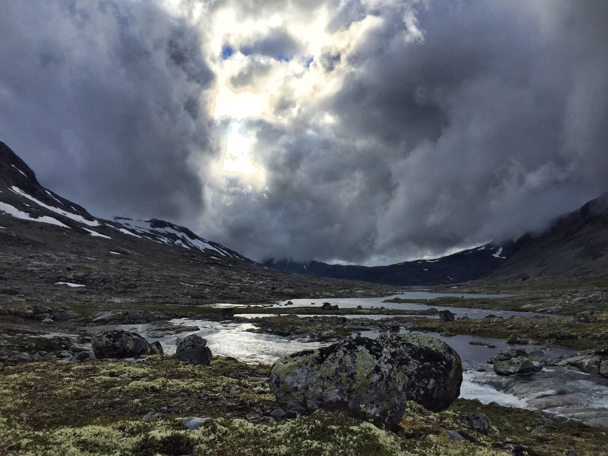 Scenic mountain lake under a stormy sky