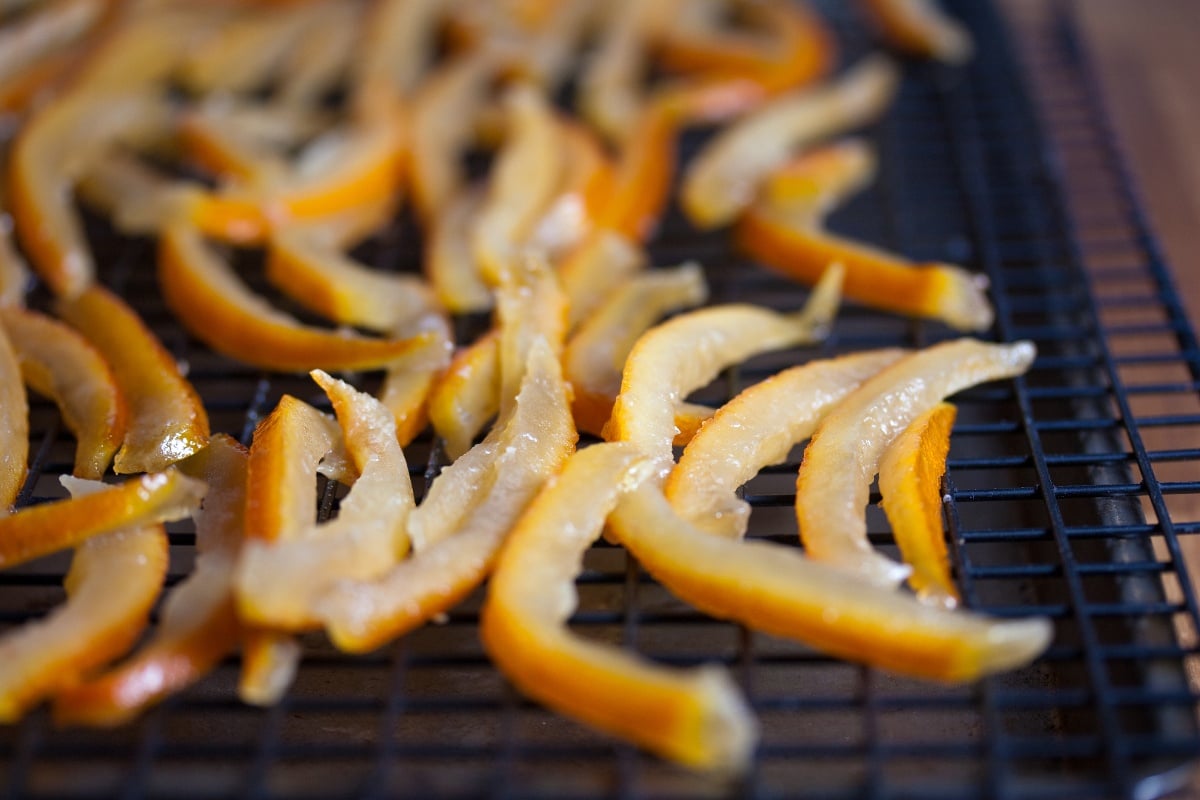 Thinly sliced orange peels on a grate