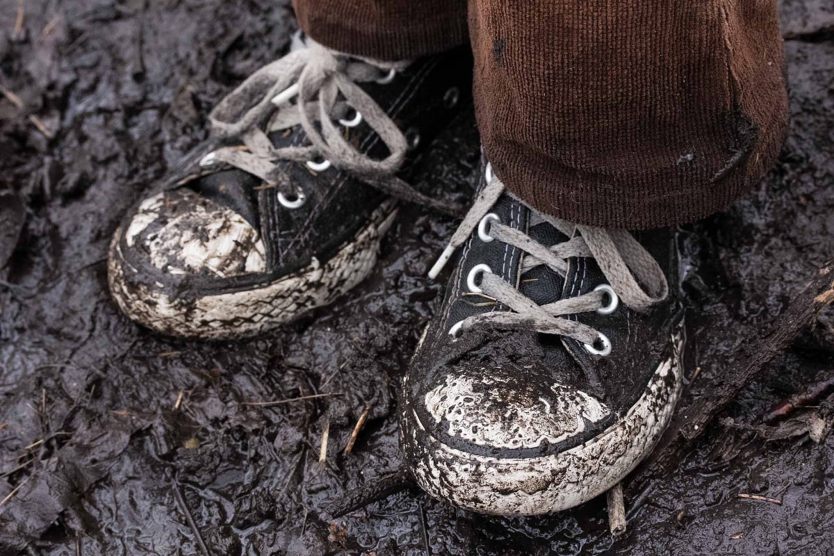 Muddy shoes on a muddy trail