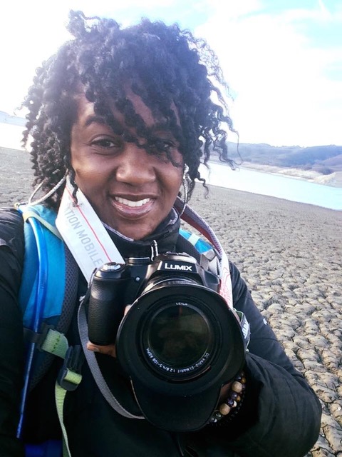 A self portrait of Day Scott with her camera