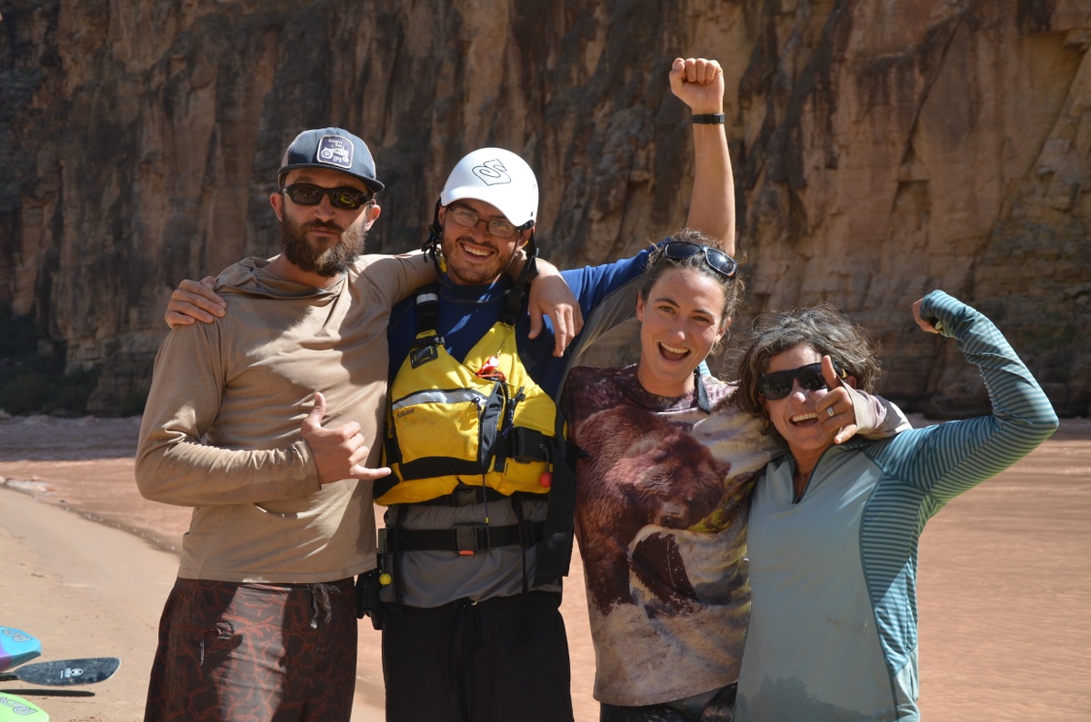 Four smiling NOLS instructors excited about their Grand Canyon trip