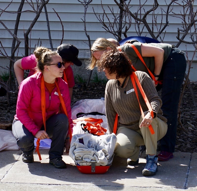 Practicing carrying a patient in a litter for wilderness first aid