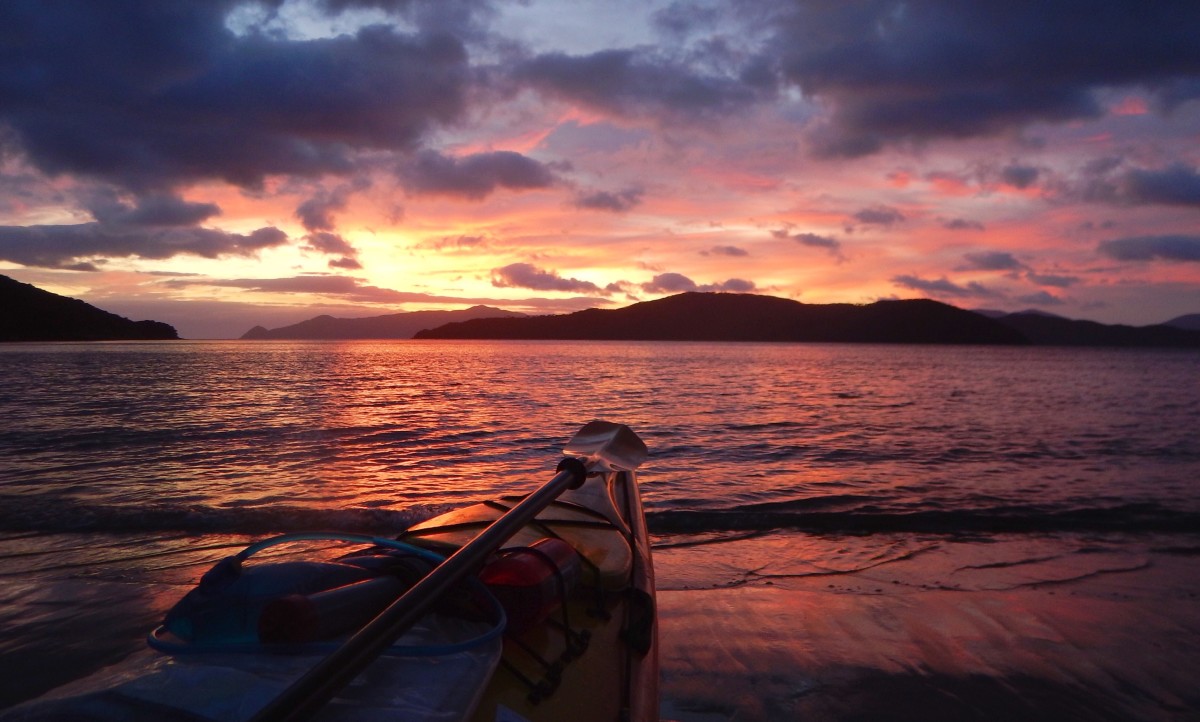 Beached kayak at sunset