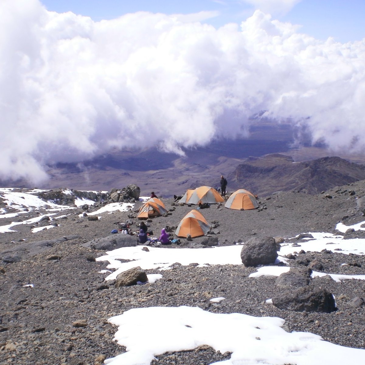 Orange tents in high camp in the mountains of Tanzania