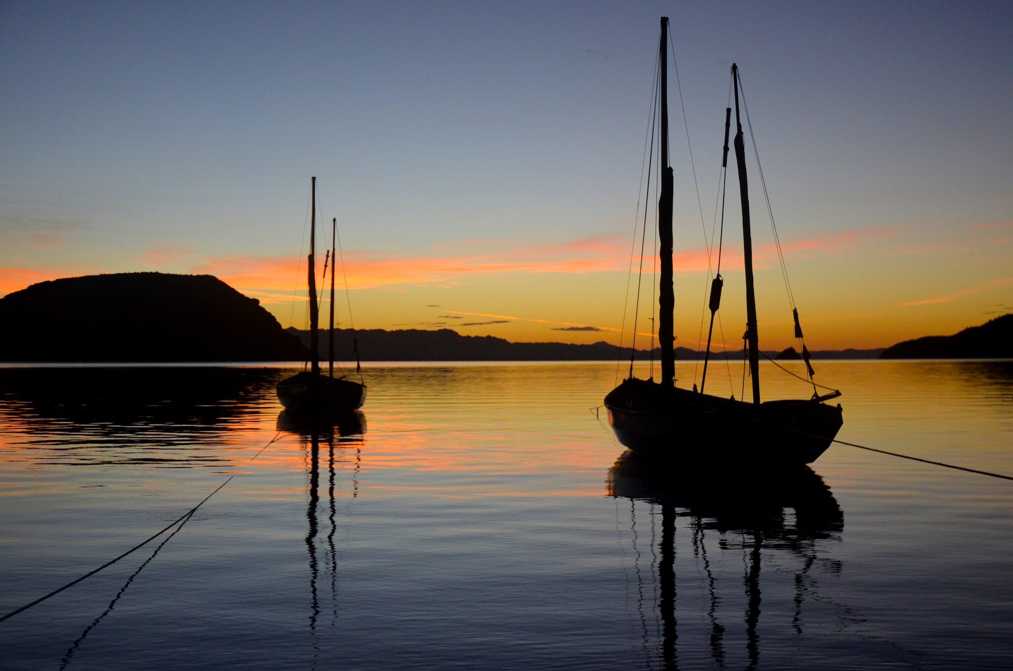 Two sailboats at sunset in Baja California