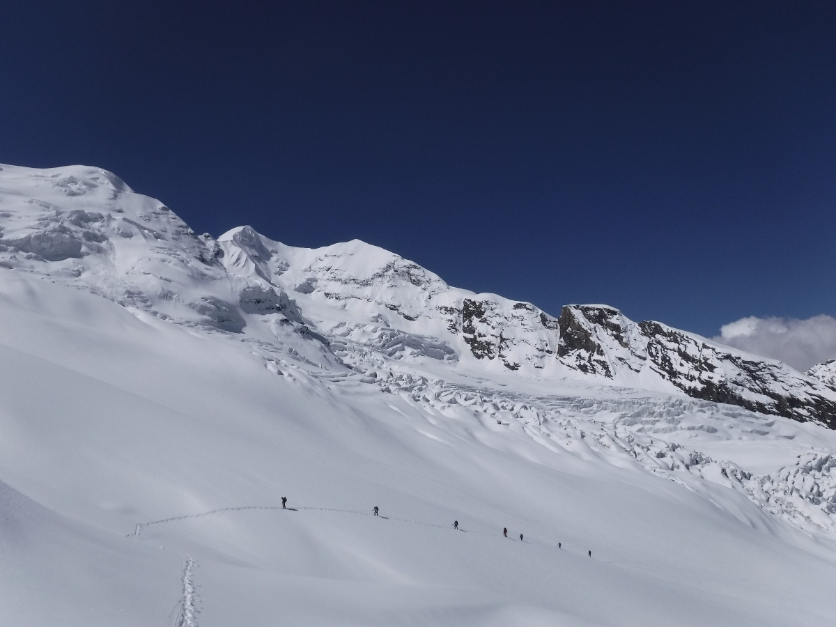 Expedition members taking advantage of a weather window, attempting to reach Kafni Col, a high pass above Camp 2