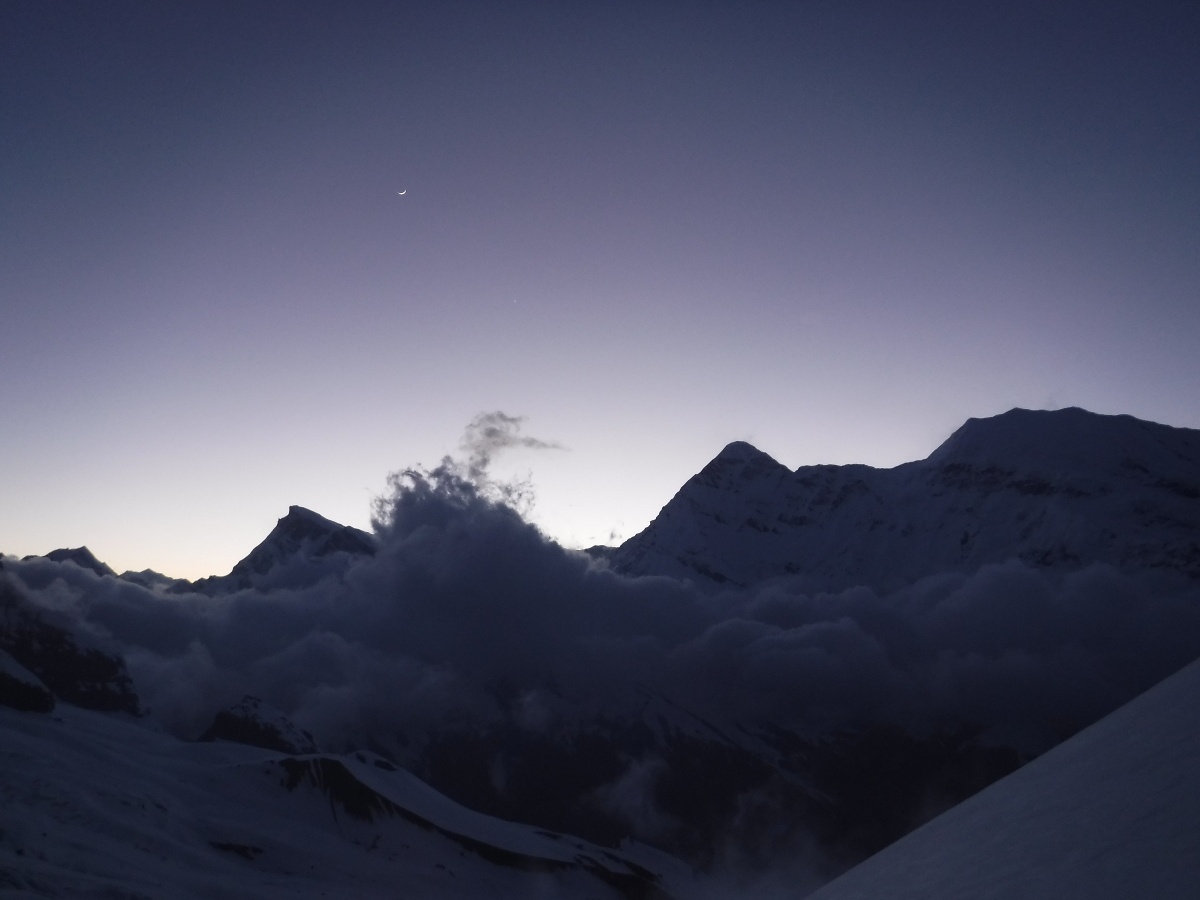 Night falls over the Pindari Valley as low hanging clouds swirl in the wind