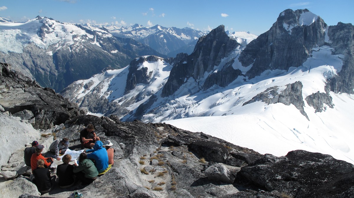 NOLS students circle up for a lesson in the mountains of the Pacific Northwest