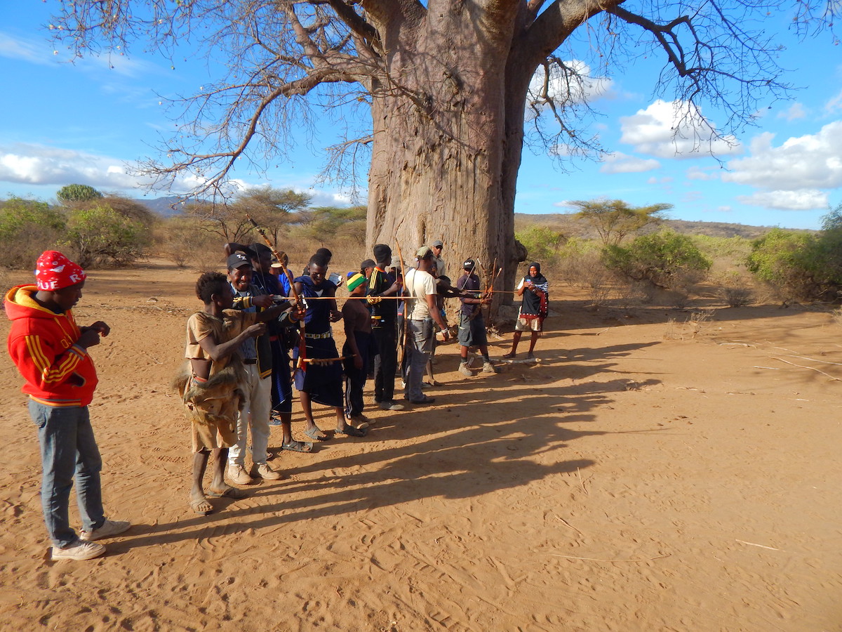 Course participants listen to instruction on using traditional bows