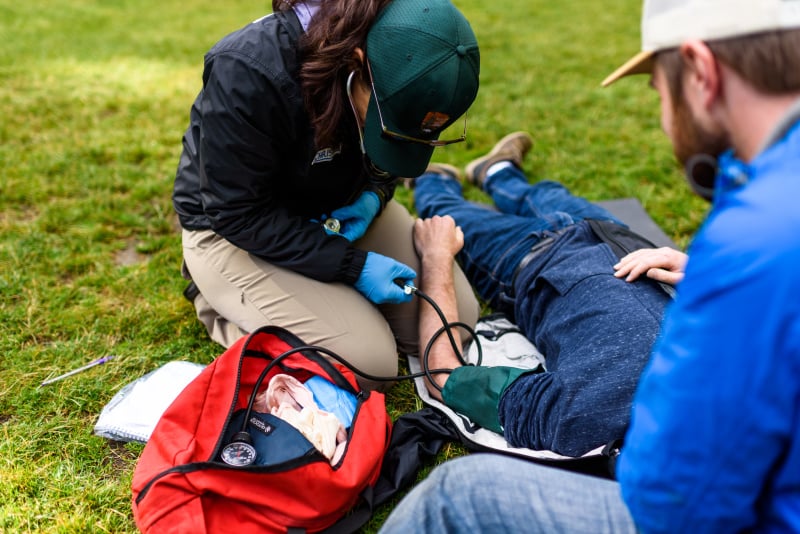 NOLS student practices taking blood pressure