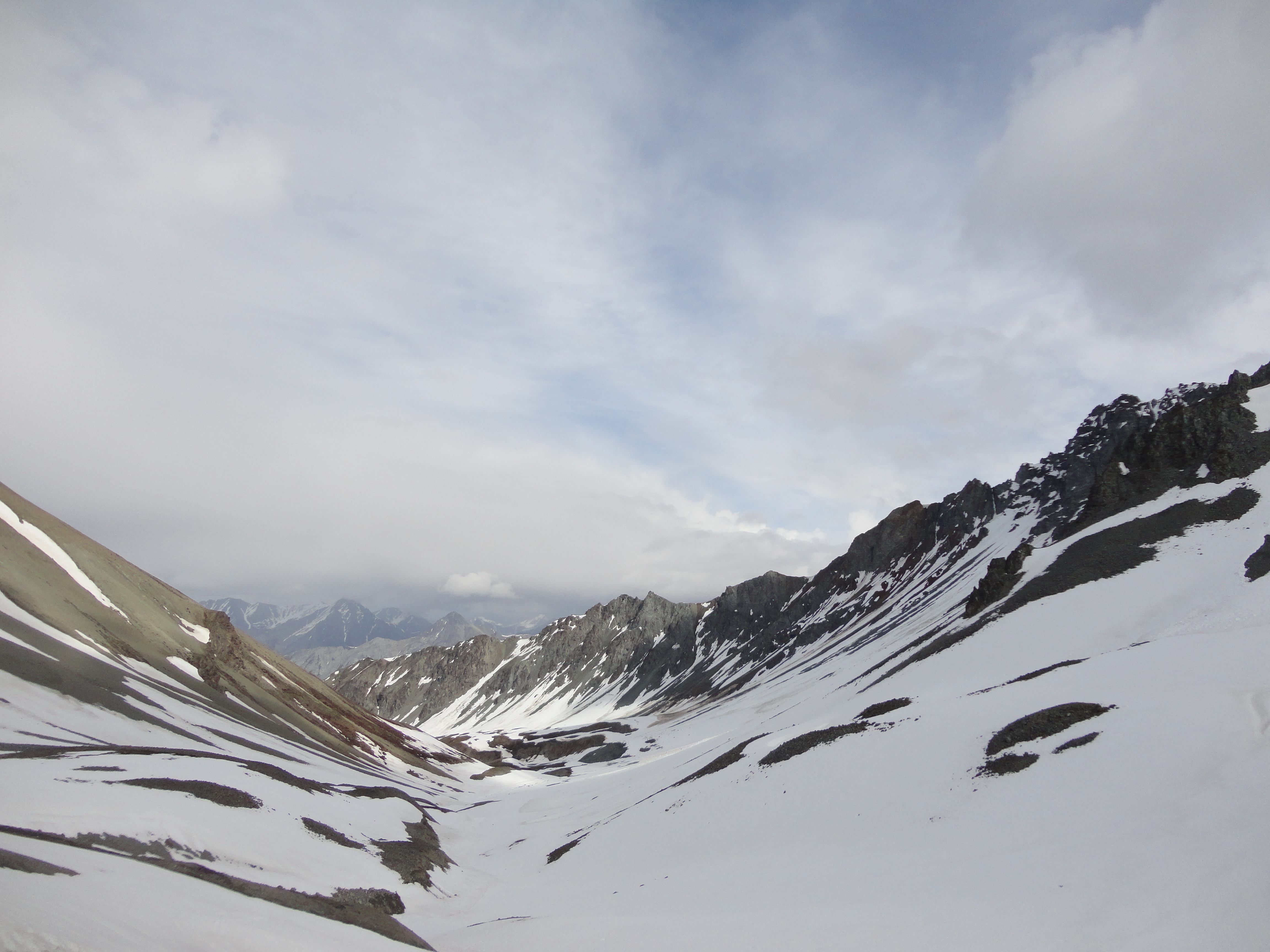 Alaska landscape with mountains and sloping snowy valley