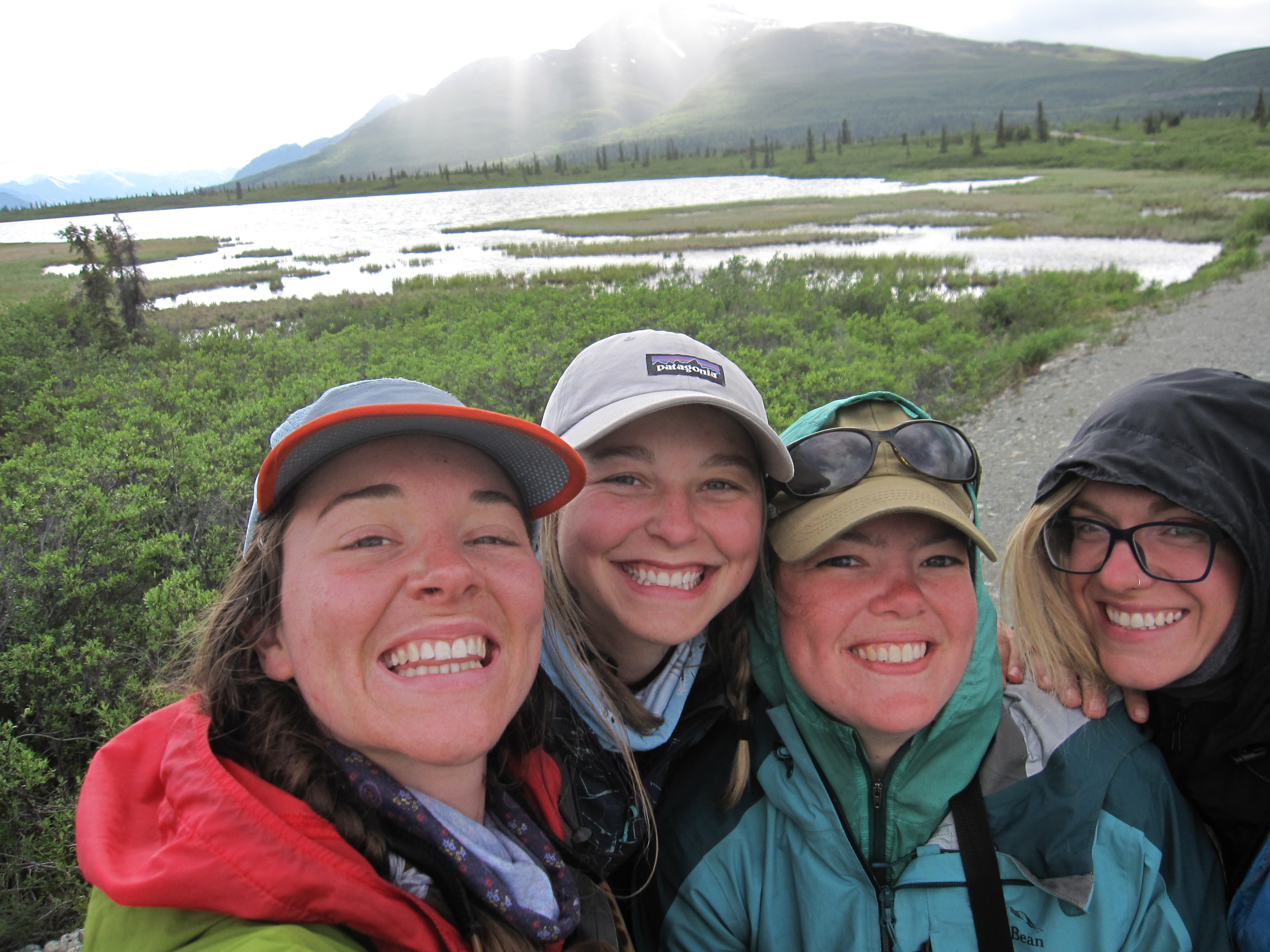 Women on a NOLS Alaska Course stop and take a selfie