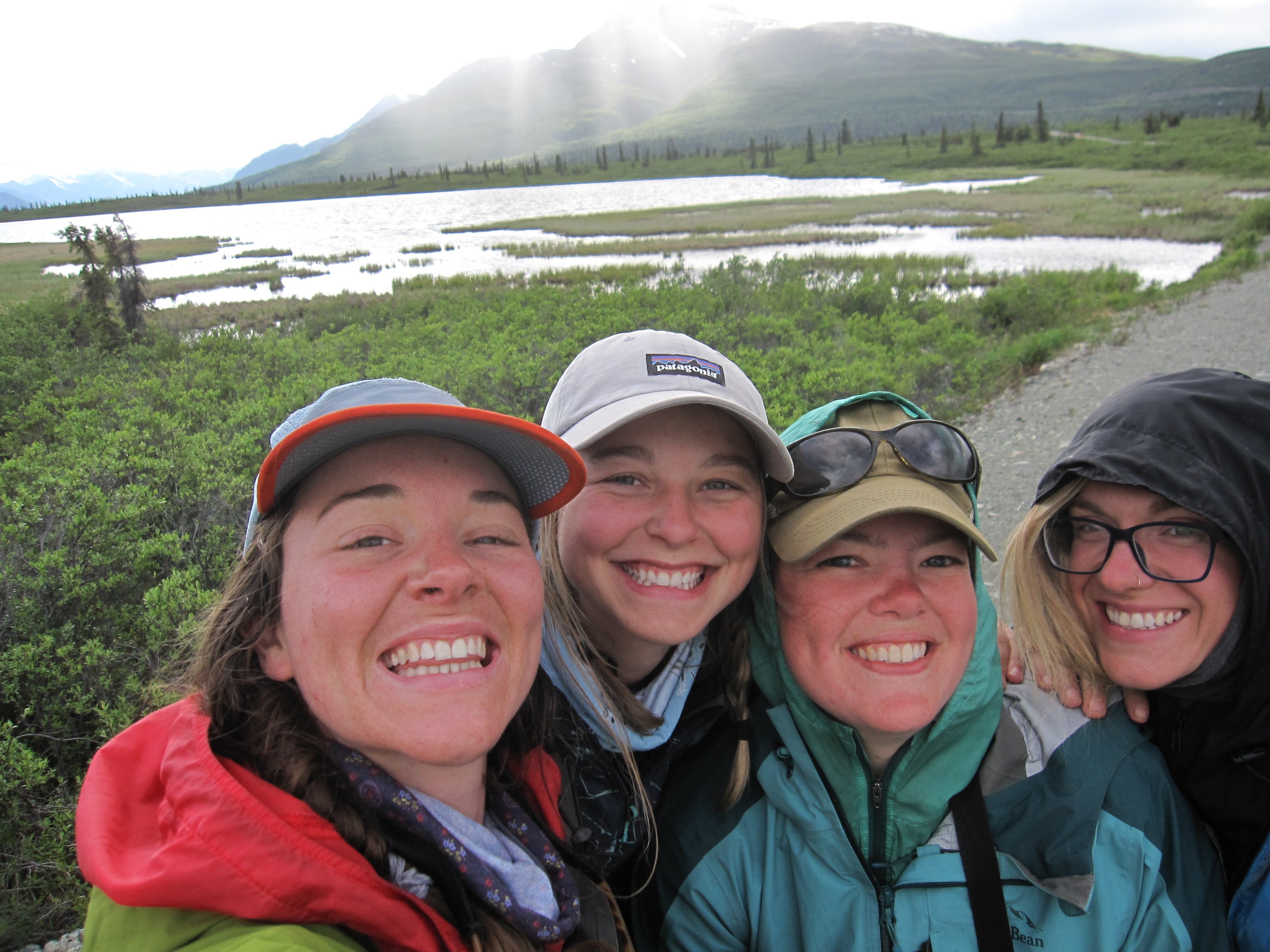 Women on a NOLS Alaska Course stop and take a selfie