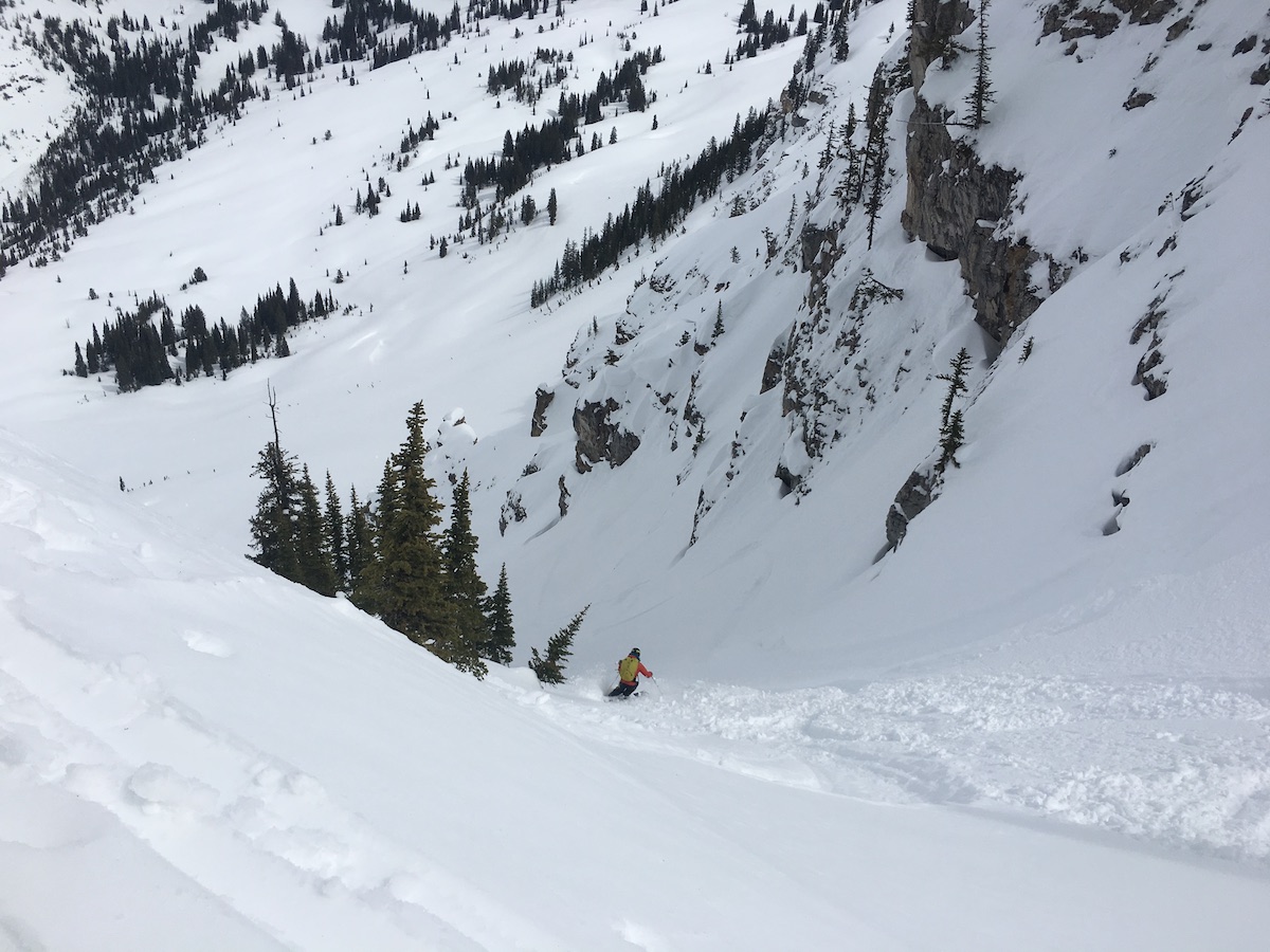 Person skiing down a snowy slope