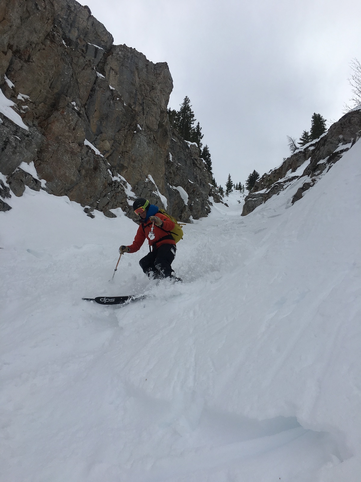 Person skiing down a chute