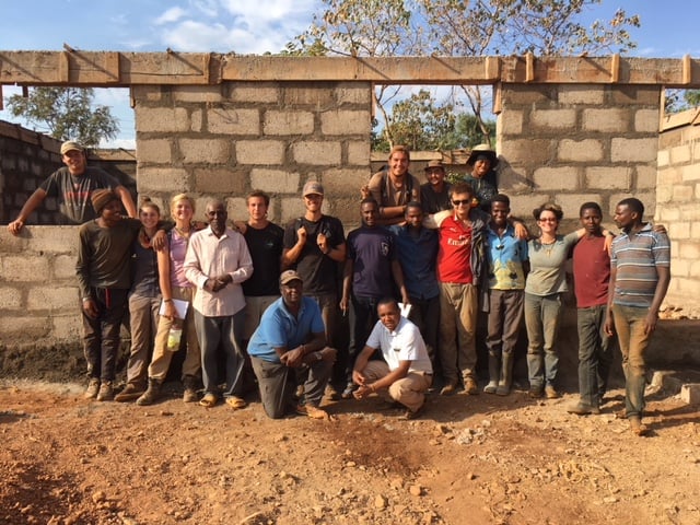 Steve's group with community members whose school they are helping build
