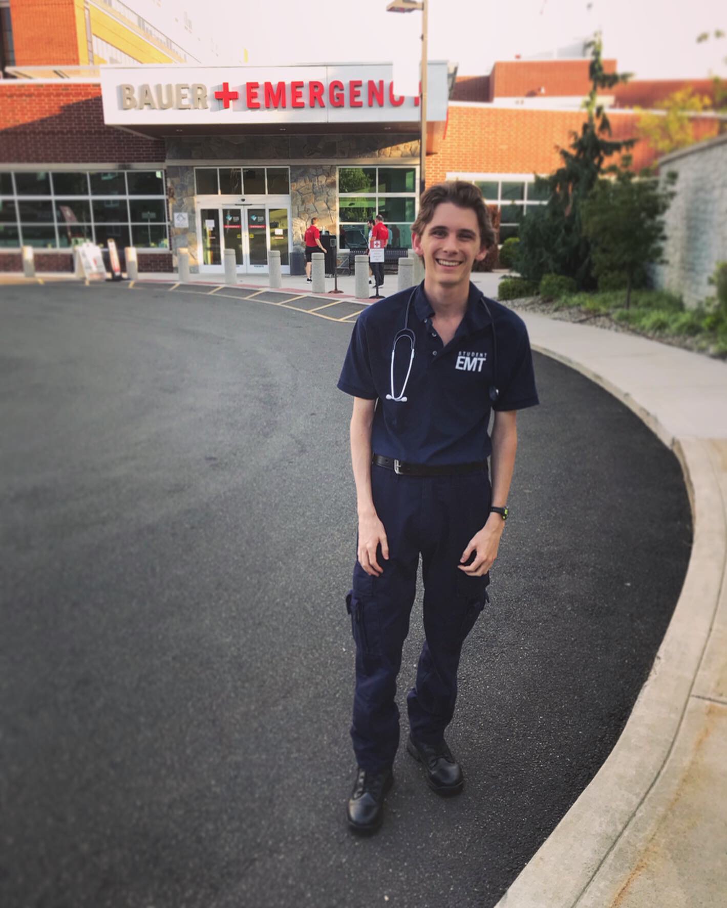 Jack after his WEMT course in front of an emergency room sign