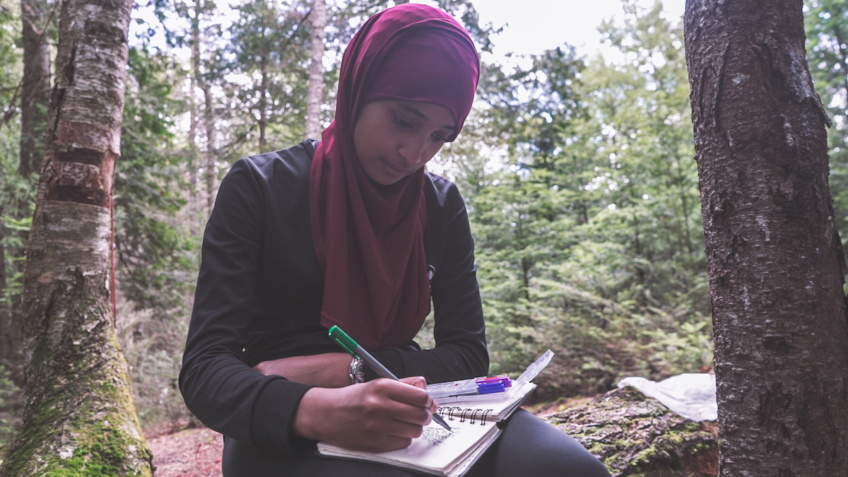 Person writing in a journal