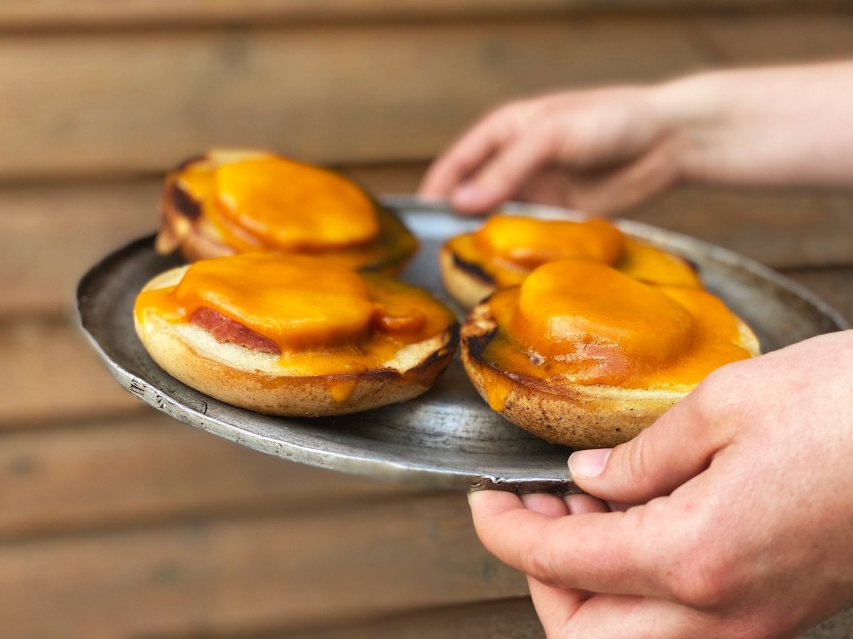 Close up of breakfast bagels on lid of a pan