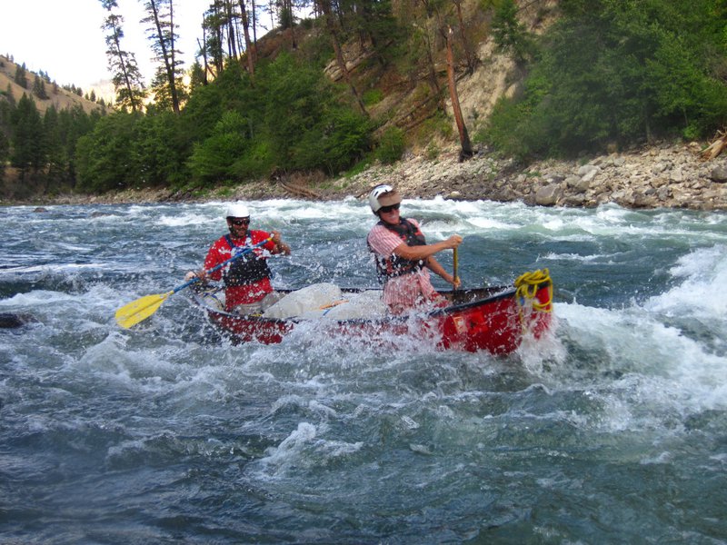 Two NOLS participants whitewater canoe on the Salmon River