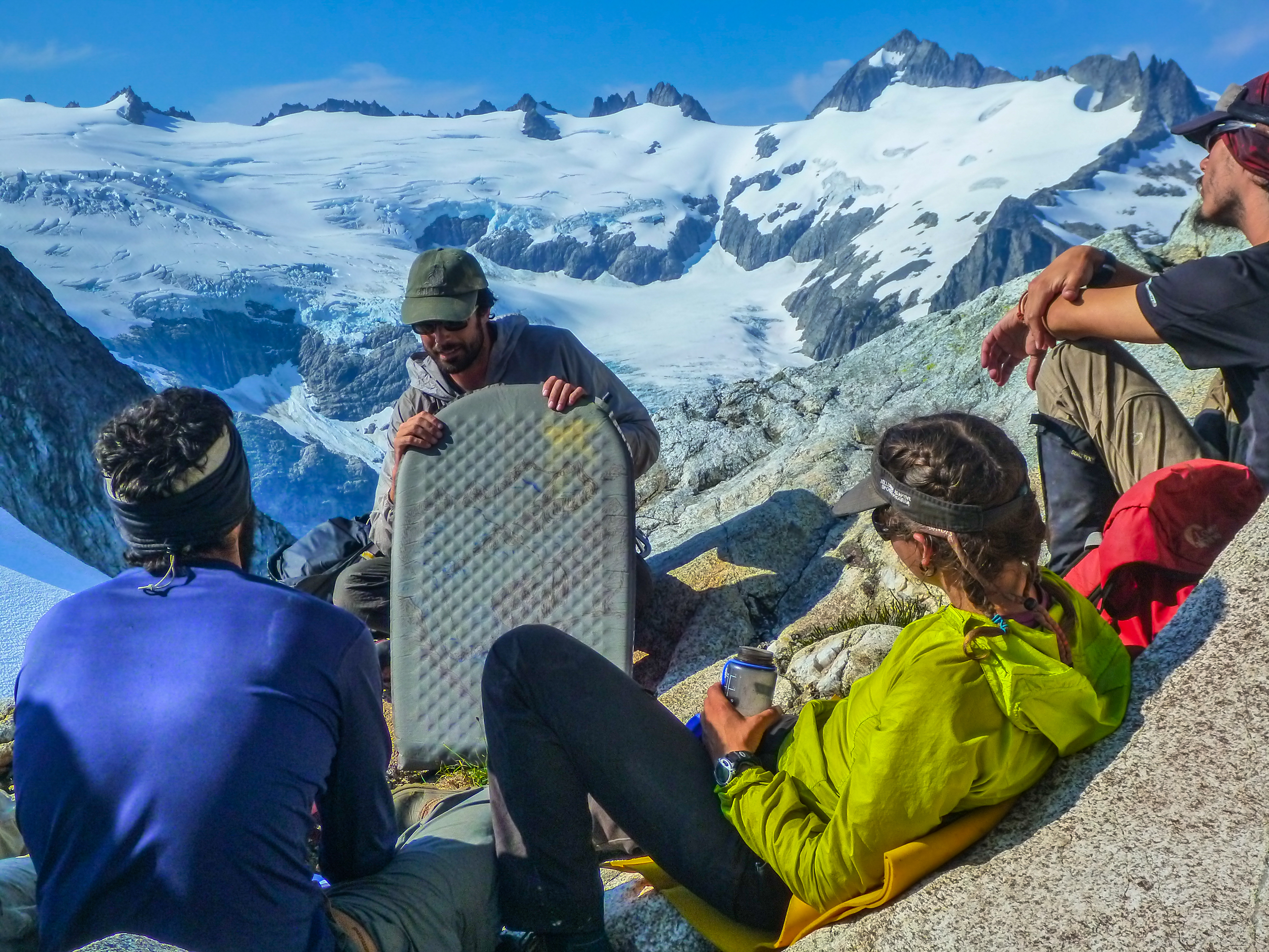 An instructor teaching students about how to set up camp in the mountains of the Pacific Northwest