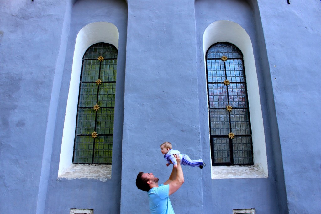 Erica's husband holds their baby in Estonia