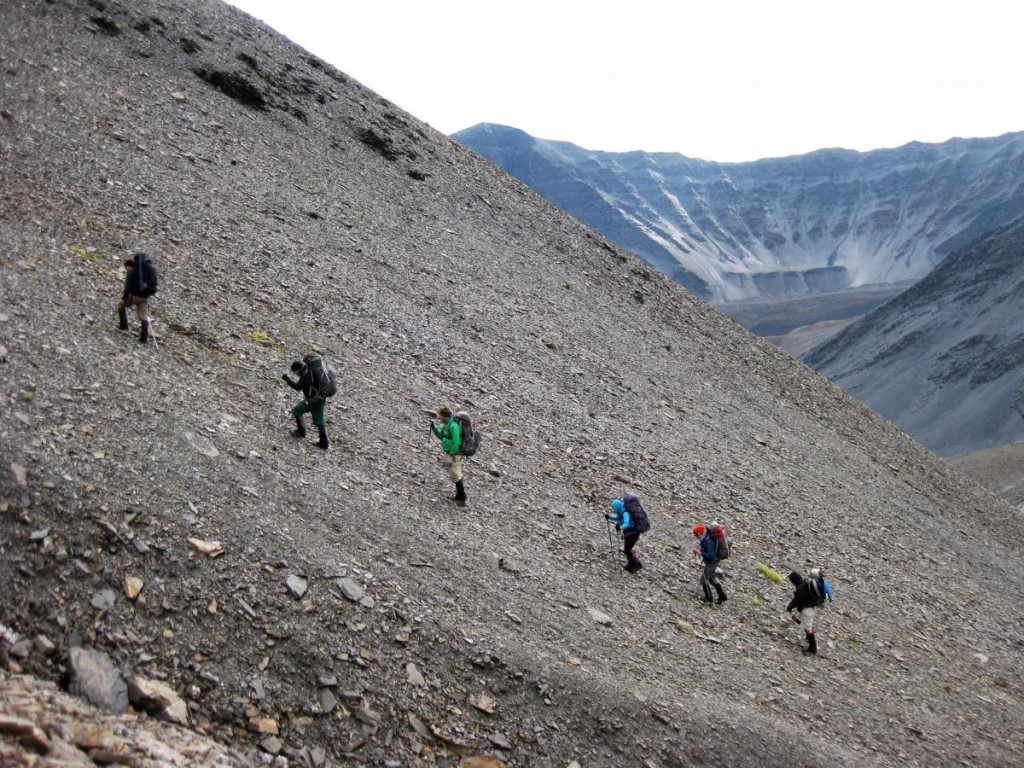 Climbing a scree slope in Alaska while backpacking