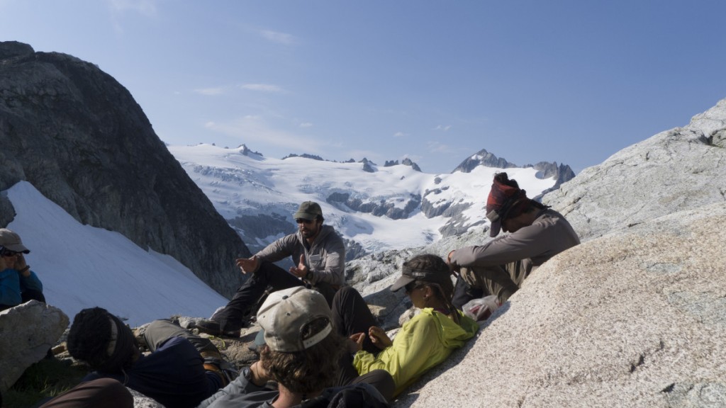 NOLS instructor teaches group of students in the mountains