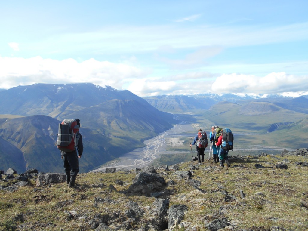 Backpackers enjoy the view from a mountain ridge