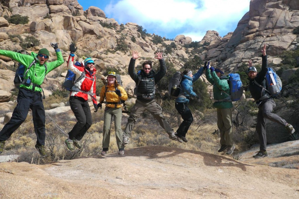 NOLS participants jump for joy in the backcountry