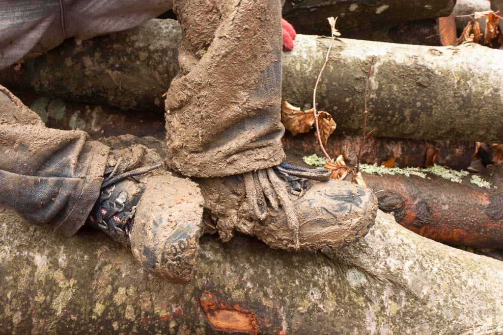 Muddy jeans and hiking boots