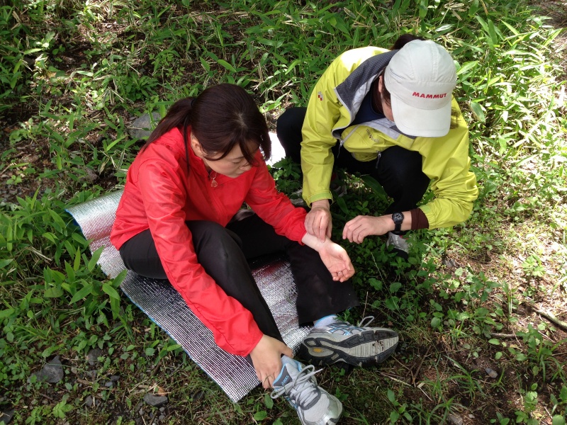 NOLS student practices taking a pulse